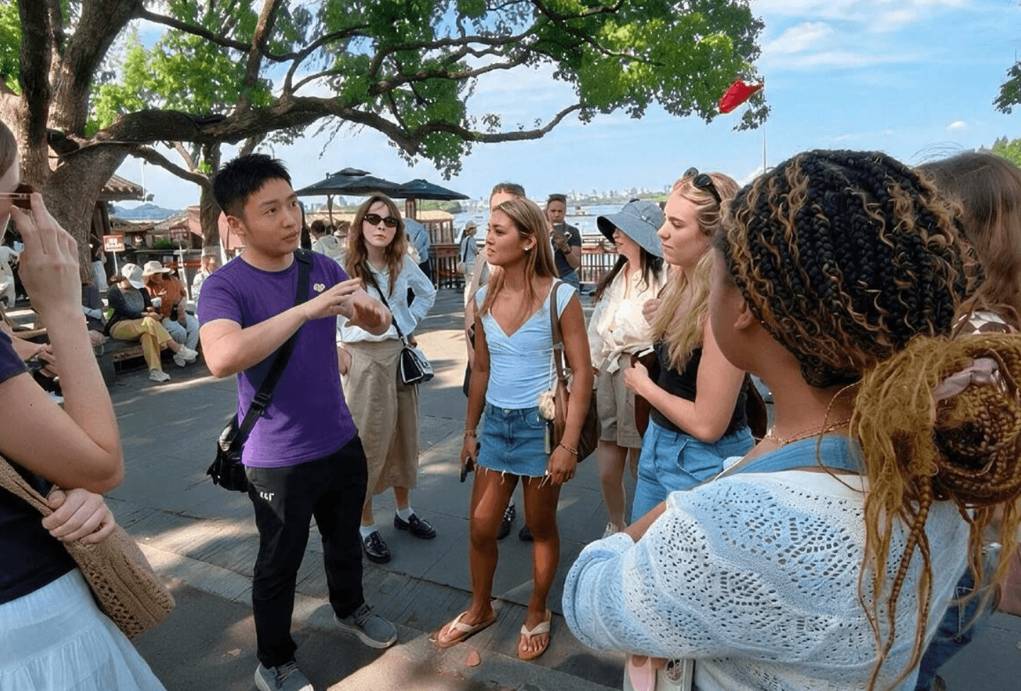 Local guide speaking with a walking tour group in Hangzhou